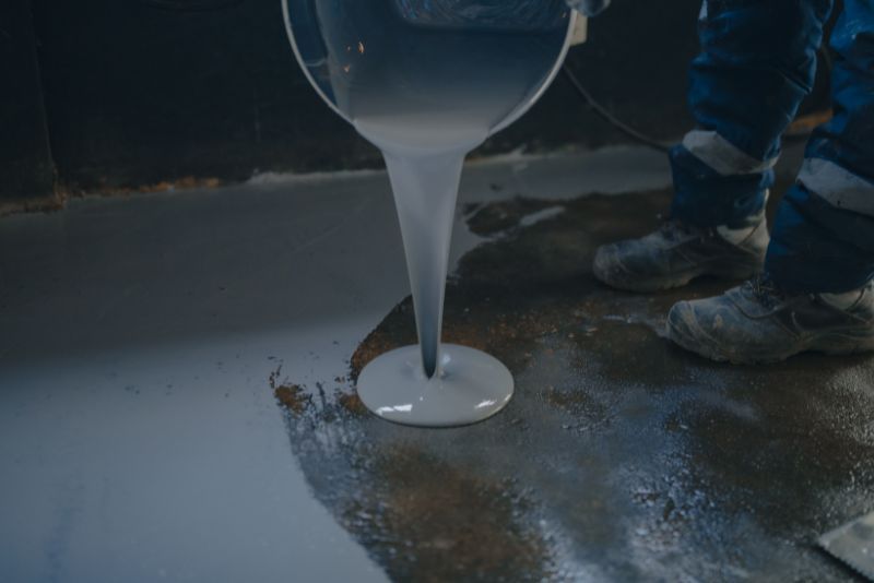 pouring epoxy floor mixture