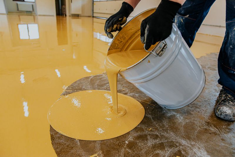 yellow epoxy mixture poured over concrete