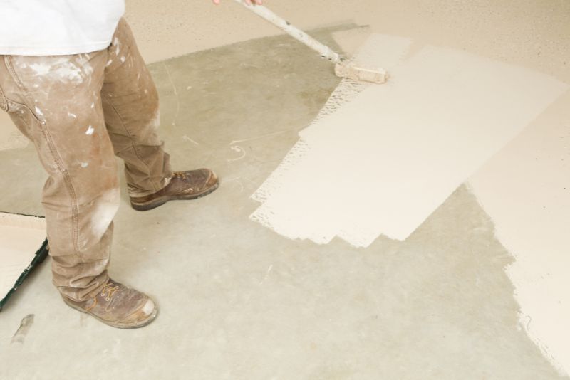 white epoxy paint applied on the concrete floor